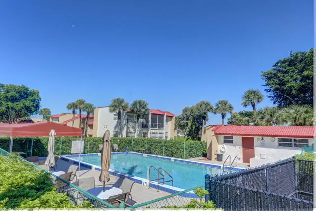 a front view of house with yard and outdoor seating