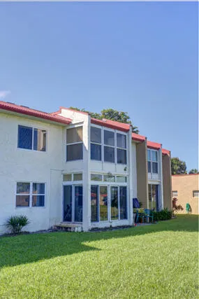 a view of a building with a yard