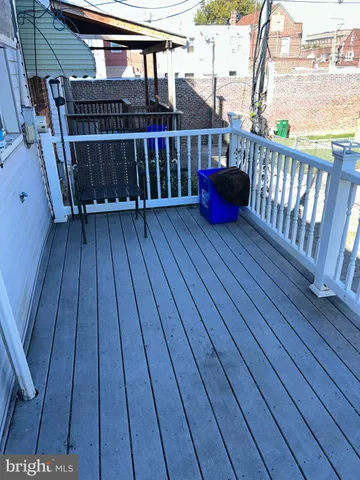 a view of balcony with wooden floor