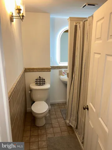 a bathroom with a toilet and a sink