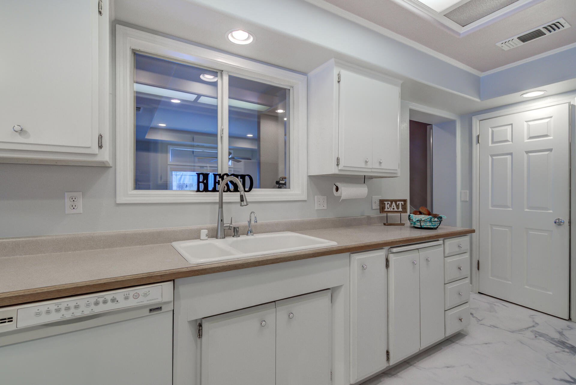 1208 Riviera Drive Redding, CA 96001 - Photo 11 of 39 a kitchen with a sink and cabinets