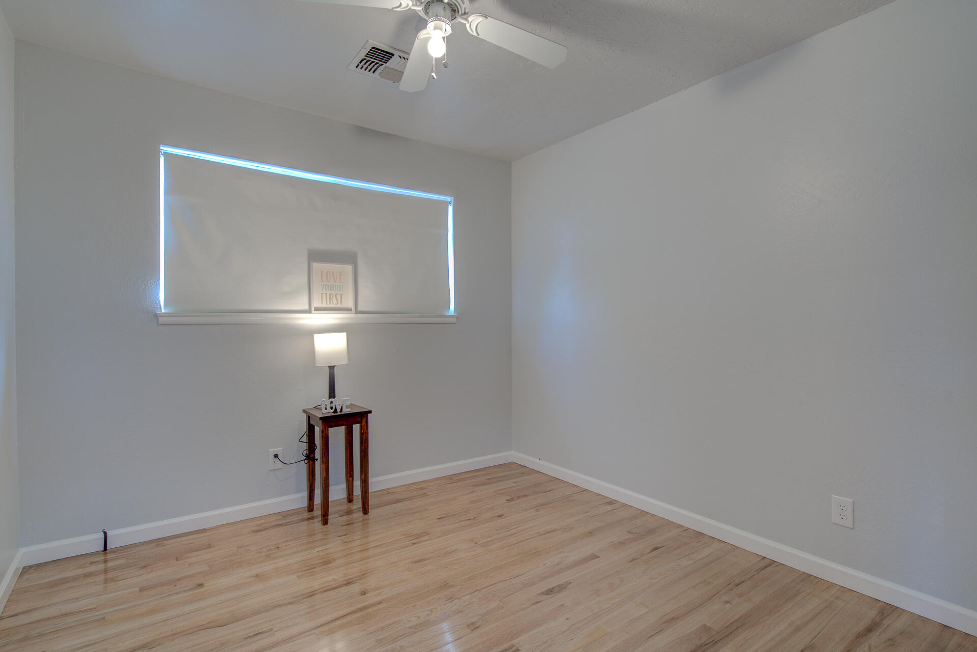 1208 Riviera Drive Redding, CA 96001 - Photo 15 of 39 a view of empty room with wooden floor
