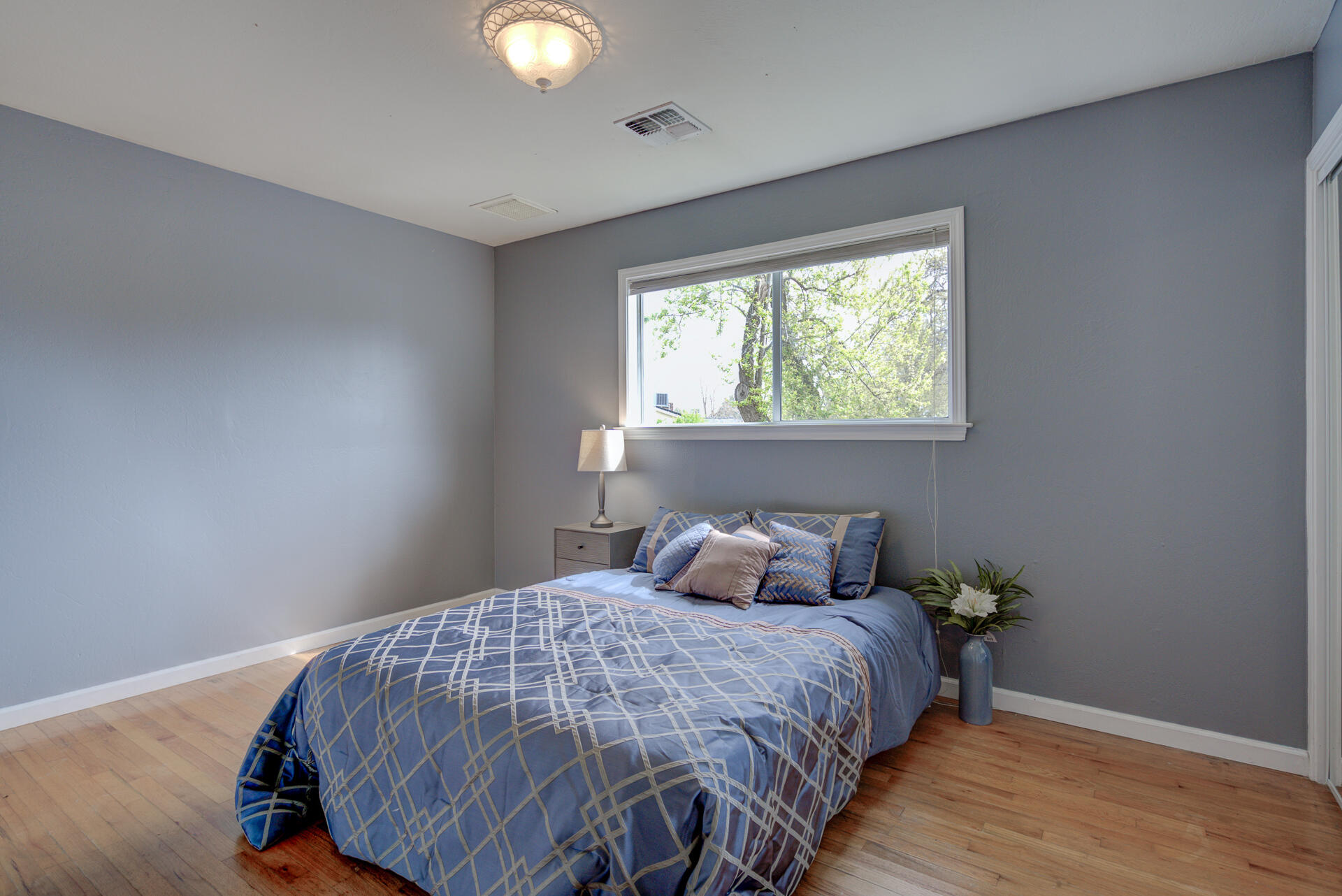 1208 Riviera Drive Redding, CA 96001 - Photo 16 of 39 a bedroom with a bed and window