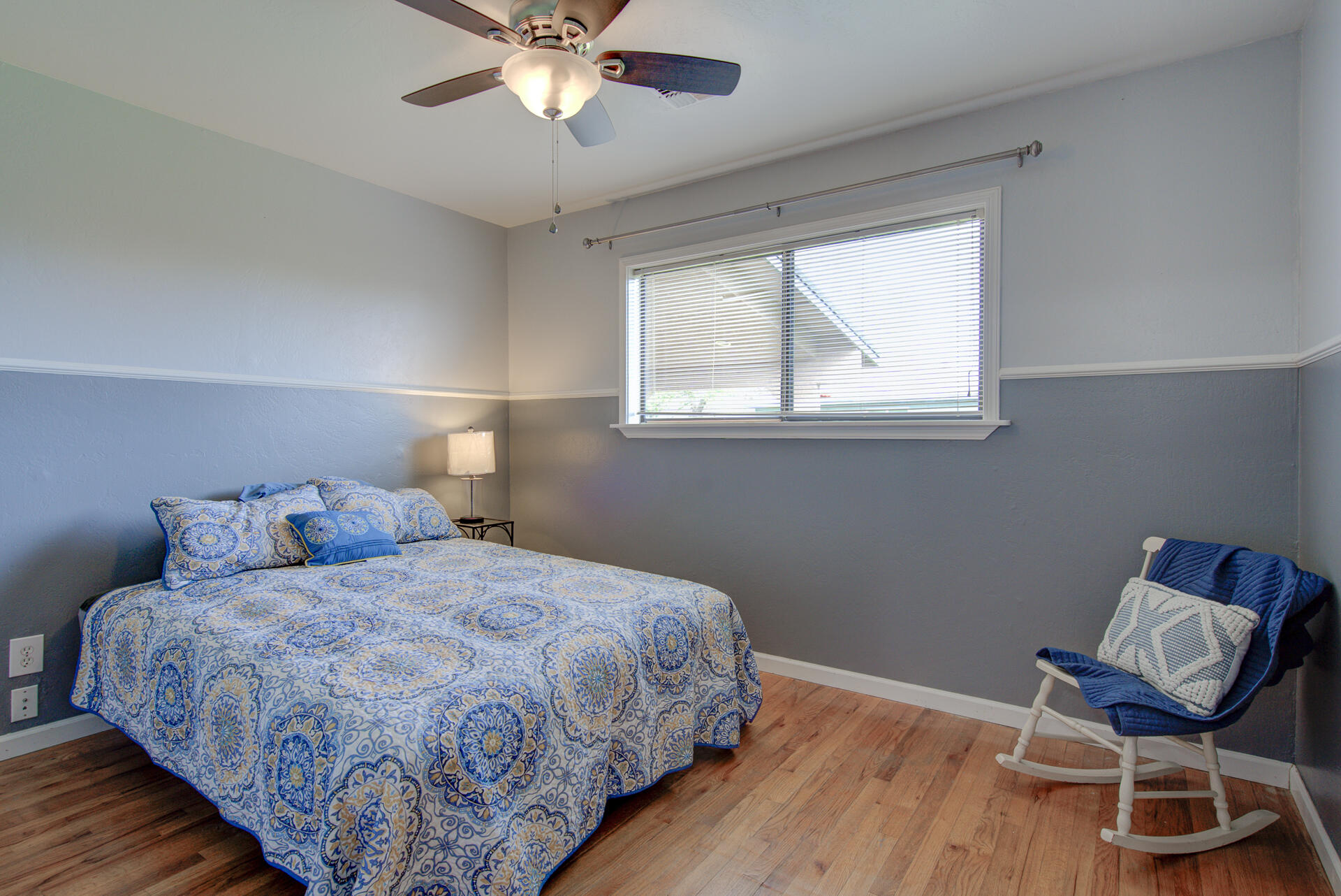 1208 Riviera Drive Redding, CA 96001 - Photo 17 of 39 a bedroom with a bed and a chair