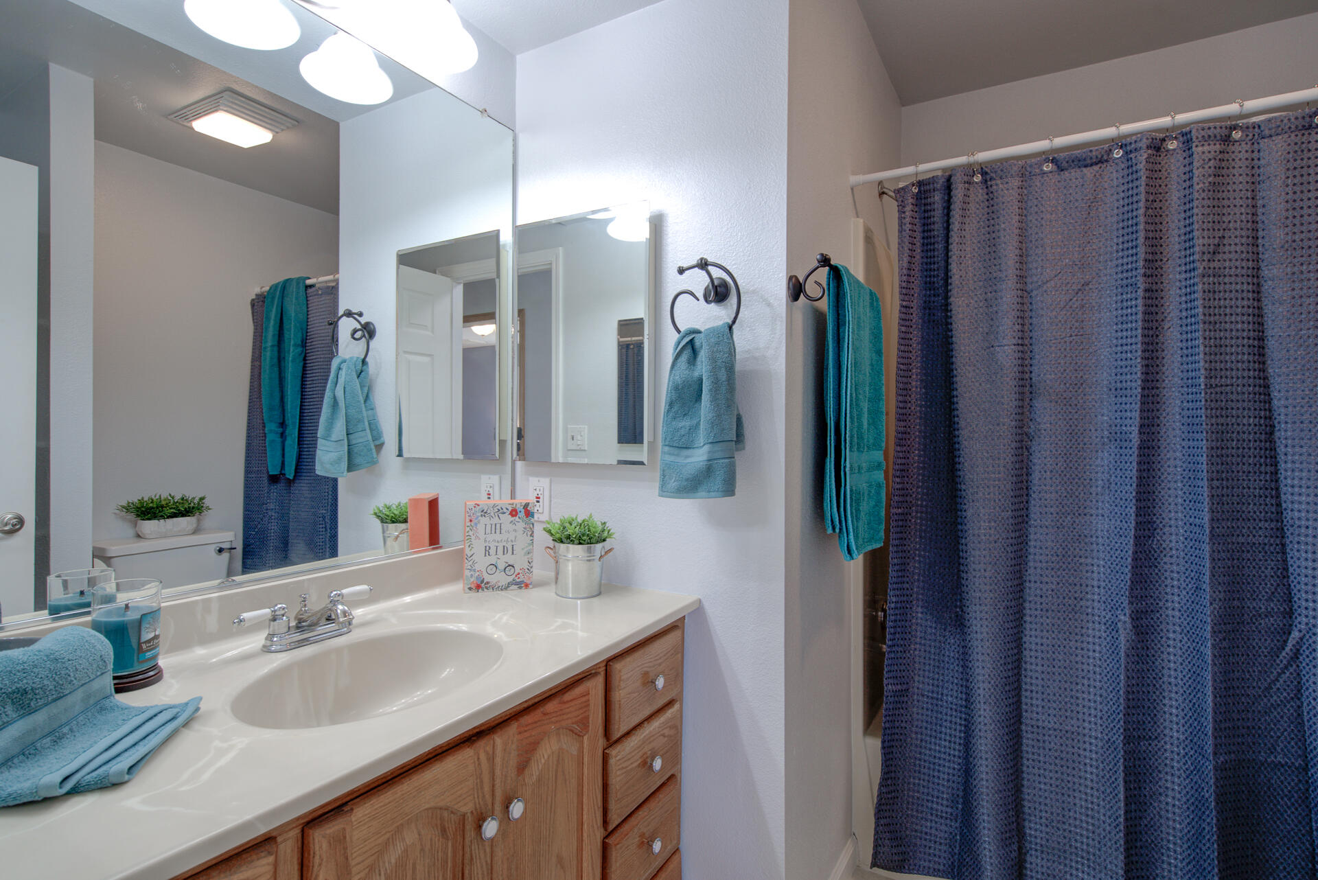 1208 Riviera Drive Redding, CA 96001 - Photo 18 of 39 a bathroom with a double vanity sink and a mirror