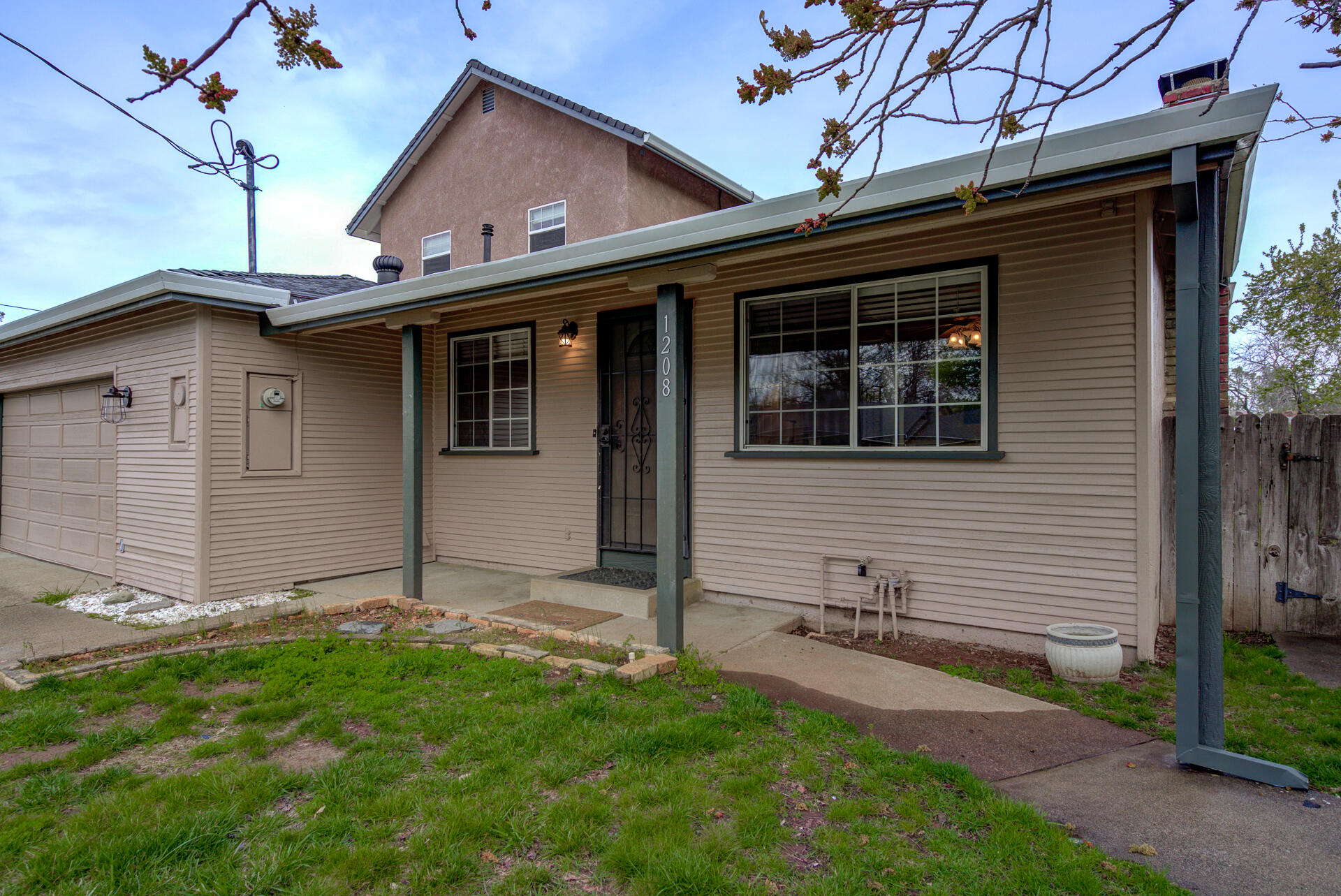 1208 Riviera Drive Redding, CA 96001 - Photo 2 of 39 a view of house with backyard and glass windows