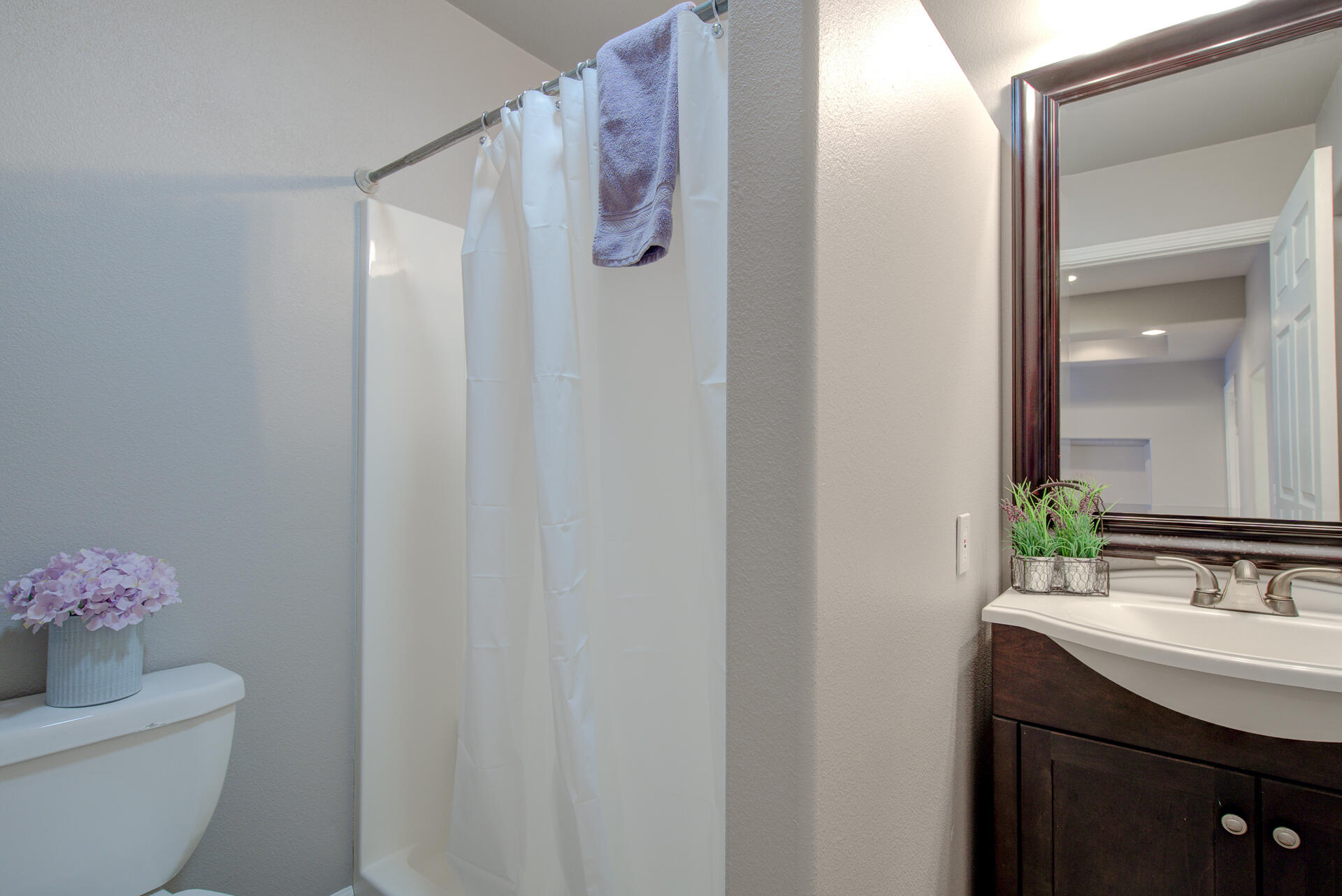 1208 Riviera Drive Redding, CA 96001 - Photo 23 of 39 a bathroom with a granite countertop sink and a mirror