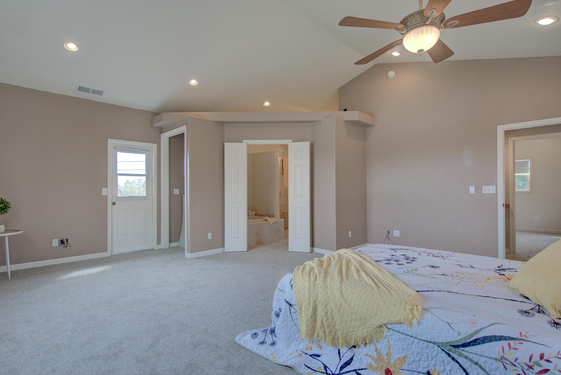 1208 Riviera Drive Redding, CA 96001 - Photo 28 of 39 a bedroom with a bed and a chandelier
