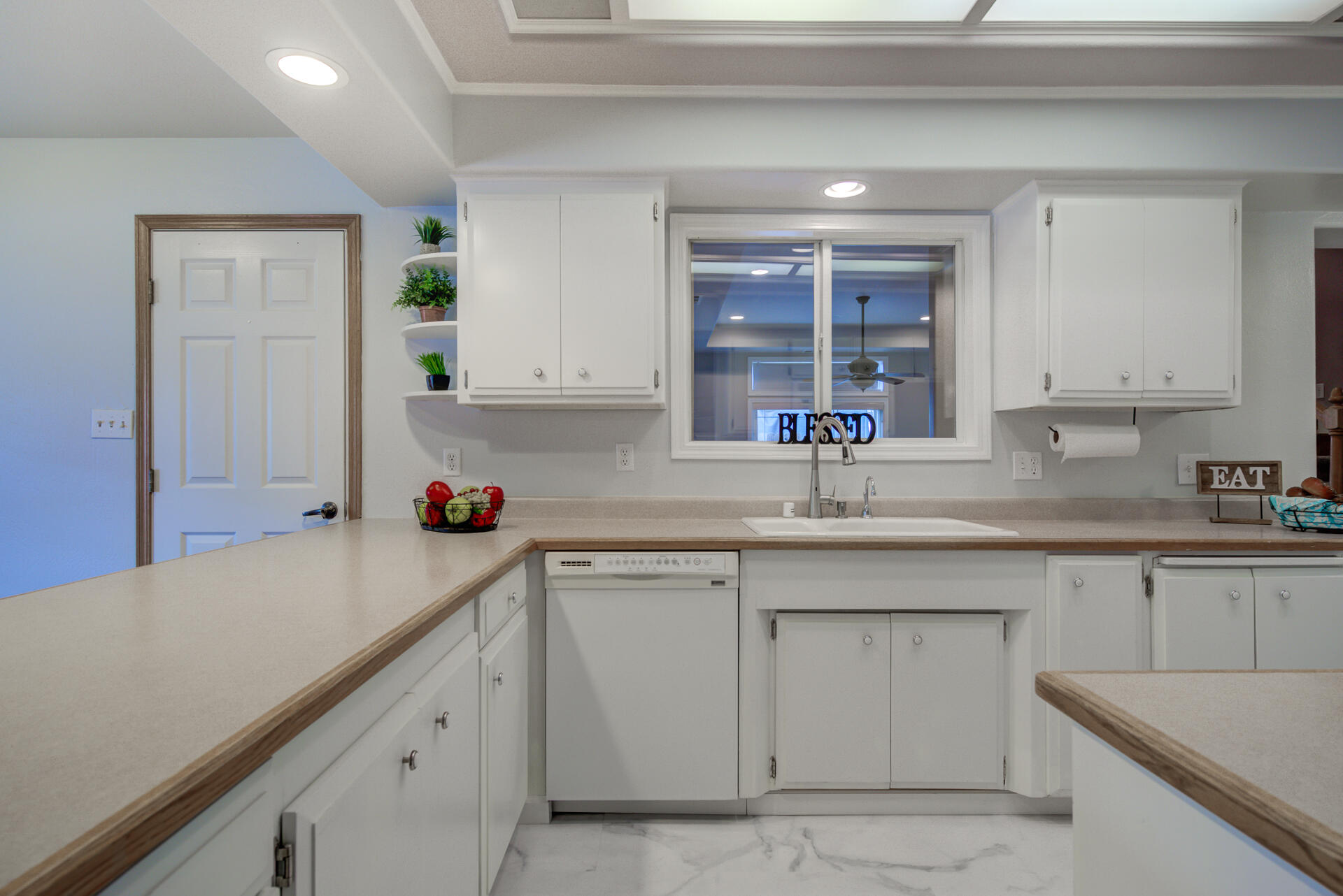 1208 Riviera Drive Redding, CA 96001 - Photo 10 of 39 a kitchen with a sink cabinets and window