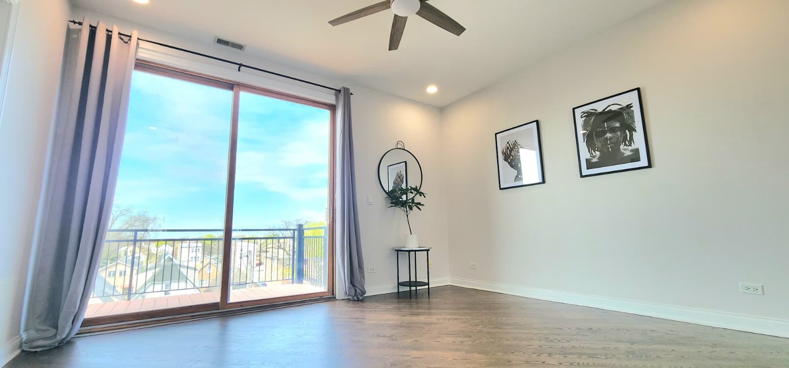 4002 South Western Avenue, Unit 4 Chicago, IL 60609 - Photo 17 of 31 a view of an empty room with a window and wooden floor