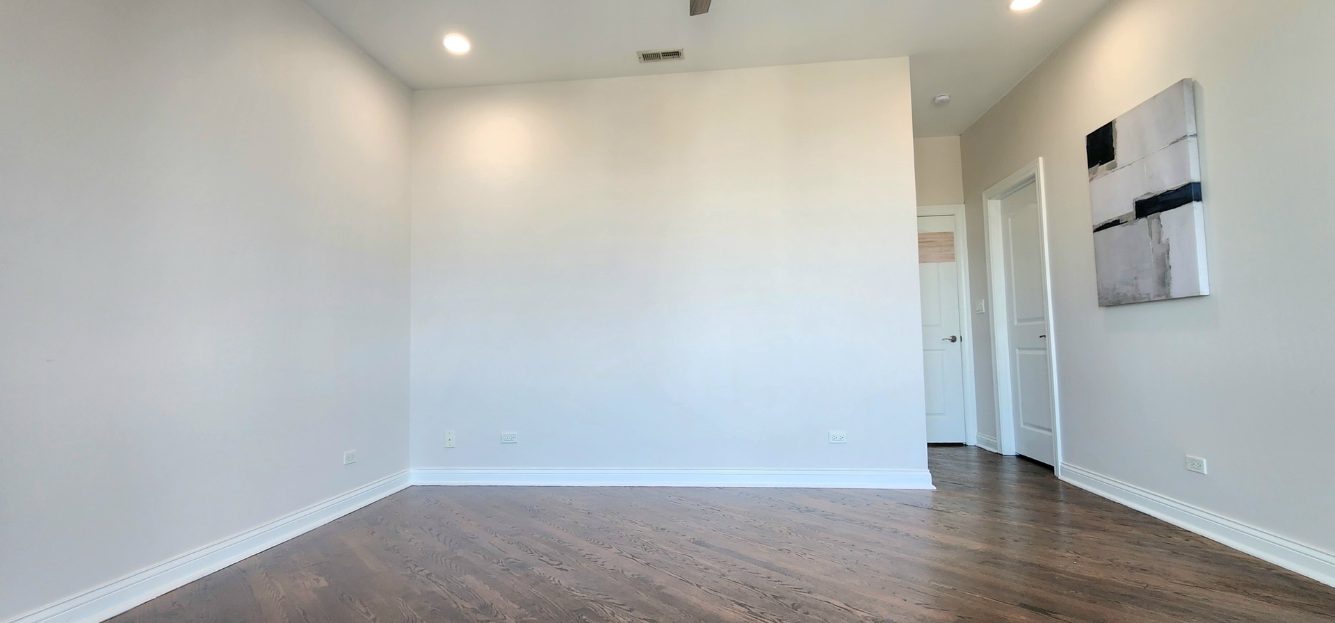 4002 South Western Avenue, Unit 4 Chicago, IL 60609 - Photo 19 of 31 a view of an empty room with wooden floor and windows
