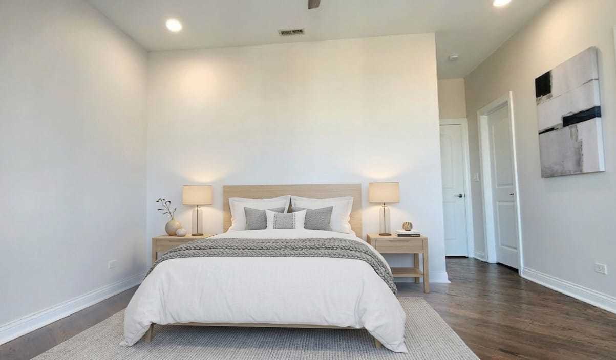 4002 South Western Avenue, Unit 4 Chicago, IL 60609 - Photo 20 of 31 a bedroom with a bed and a night stand