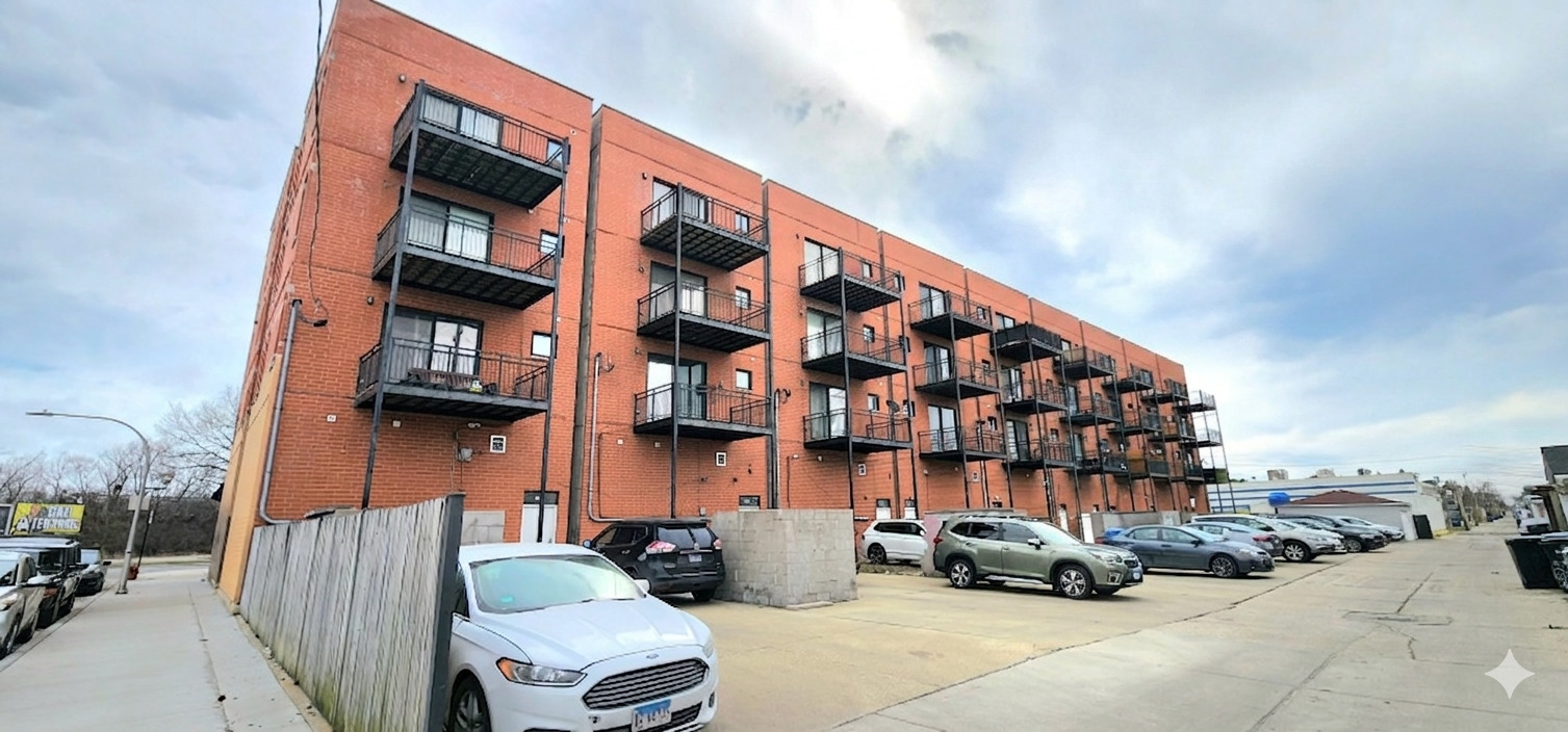 4002 South Western Avenue, Unit 4 Chicago, IL 60609 - Photo 29 of 31 a view of buildings with cars parked in front of it