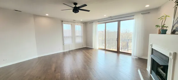a view of entryway with wooden floor and door