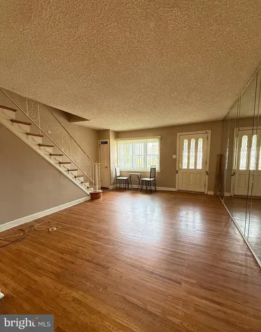 a view of a livingroom with wooden floor