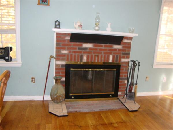 1083 Old Coldbrook Road Barre, MA 01005 - Photo 9 of 14 a living room with furniture and a fireplace