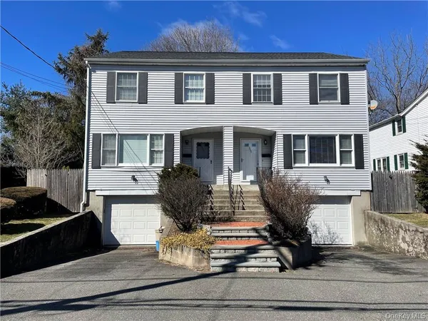 a front view of house with yard