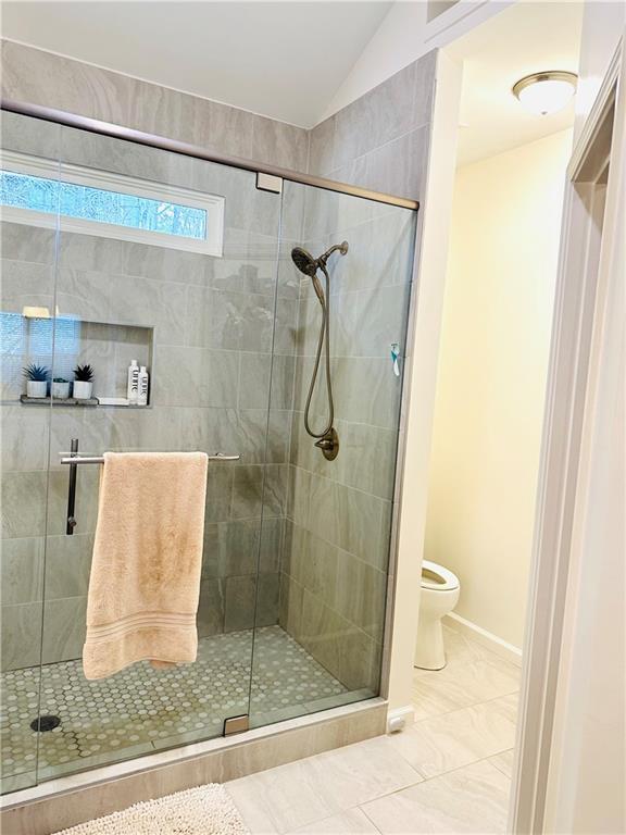 8002 Ashwell Court Woodstock, GA 30189 - Photo 14 of 14 a bathroom with a shower