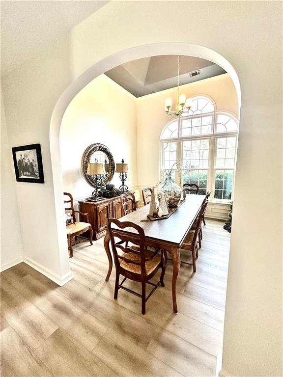 8002 Ashwell Court Woodstock, GA 30189 - Photo 4 of 14 a view of a dining room with furniture and a window