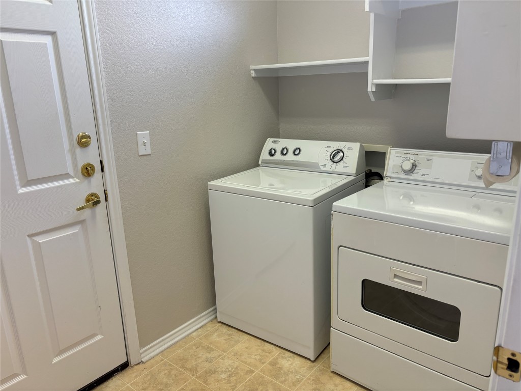 106 Bowie Circle Georgetown, TX 78633 - Photo 12 of 33 a utility room with dryer and washer