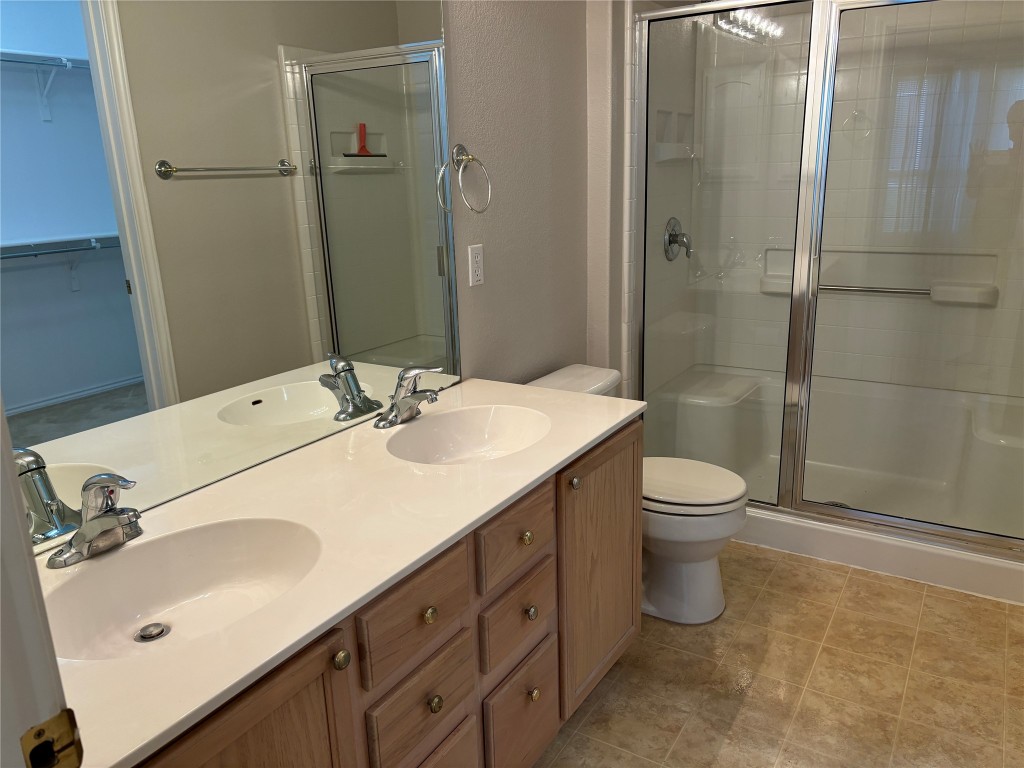 106 Bowie Circle Georgetown, TX 78633 - Photo 16 of 33 a bathroom with a sink toilet and shower