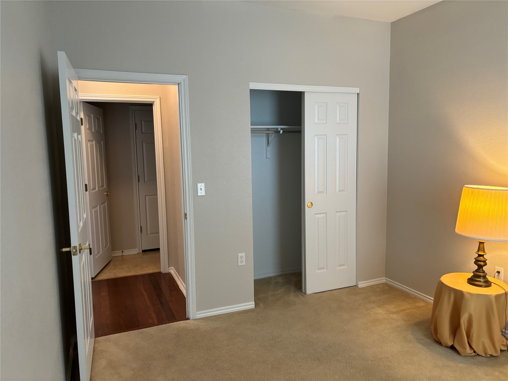 106 Bowie Circle Georgetown, TX 78633 - Photo 23 of 33 a bedroom with a bed and a table in it