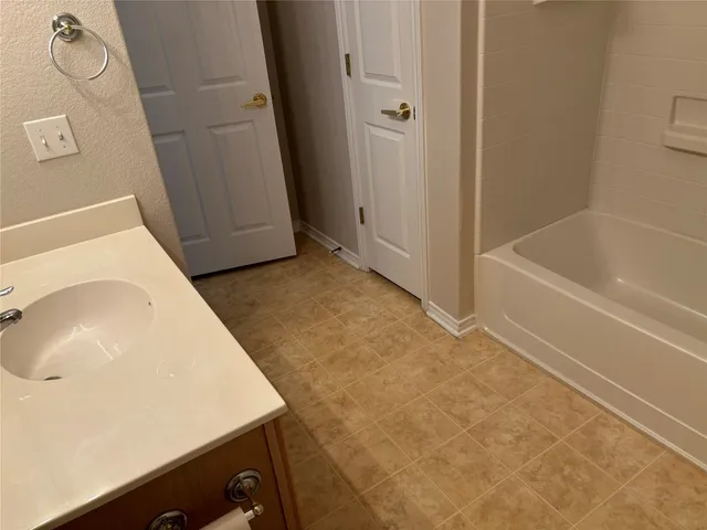 a bathroom with a sink and a vanity