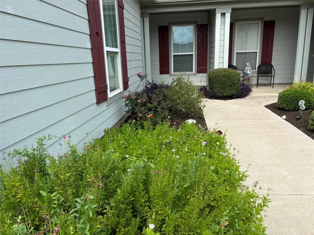 a view of a house with a garden