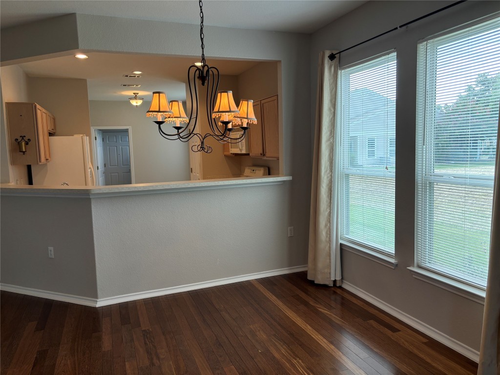 106 Bowie Circle Georgetown, TX 78633 - Photo 6 of 33 a view of a room with wooden floor and a window