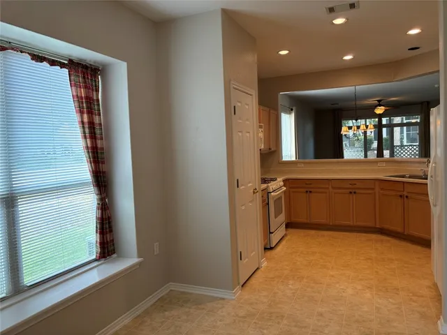 a view of a hallway with a washer and dryer