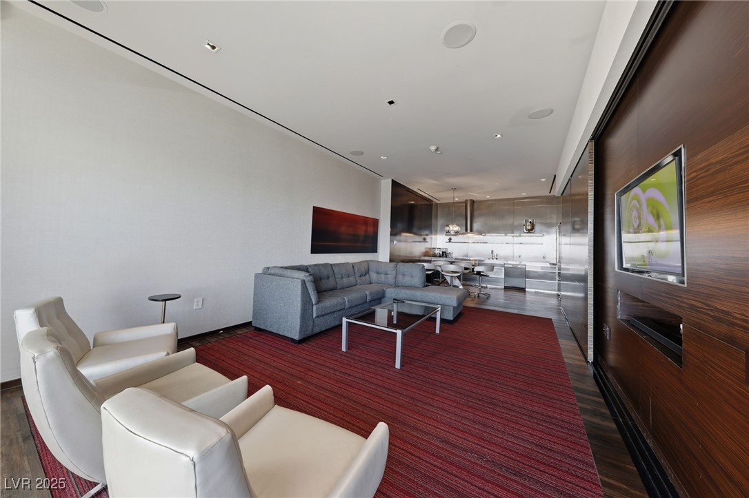 4381 West Flamingo Road, Unit 58301 Las Vegas, NV 89103 - Photo 12 of 32 Living room with dark wood-style flooring and recessed lighting