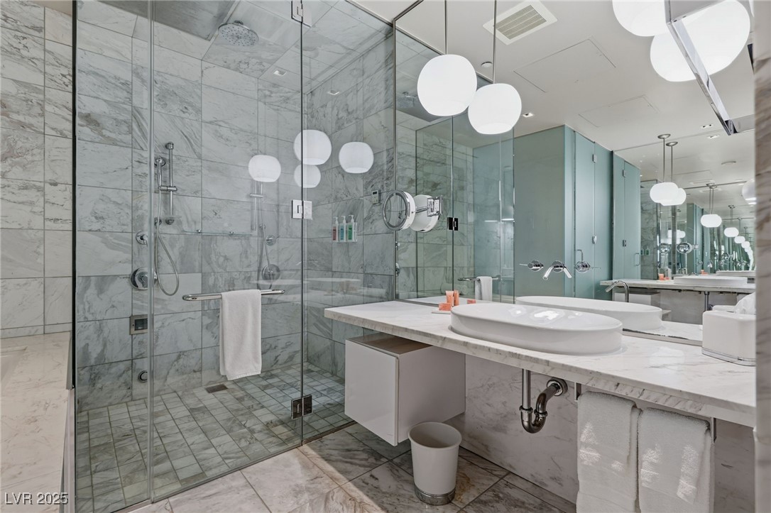 4381 West Flamingo Road, Unit 58301 Las Vegas, NV 89103 - Photo 21 of 32 Bathroom featuring vanity and a shower stall