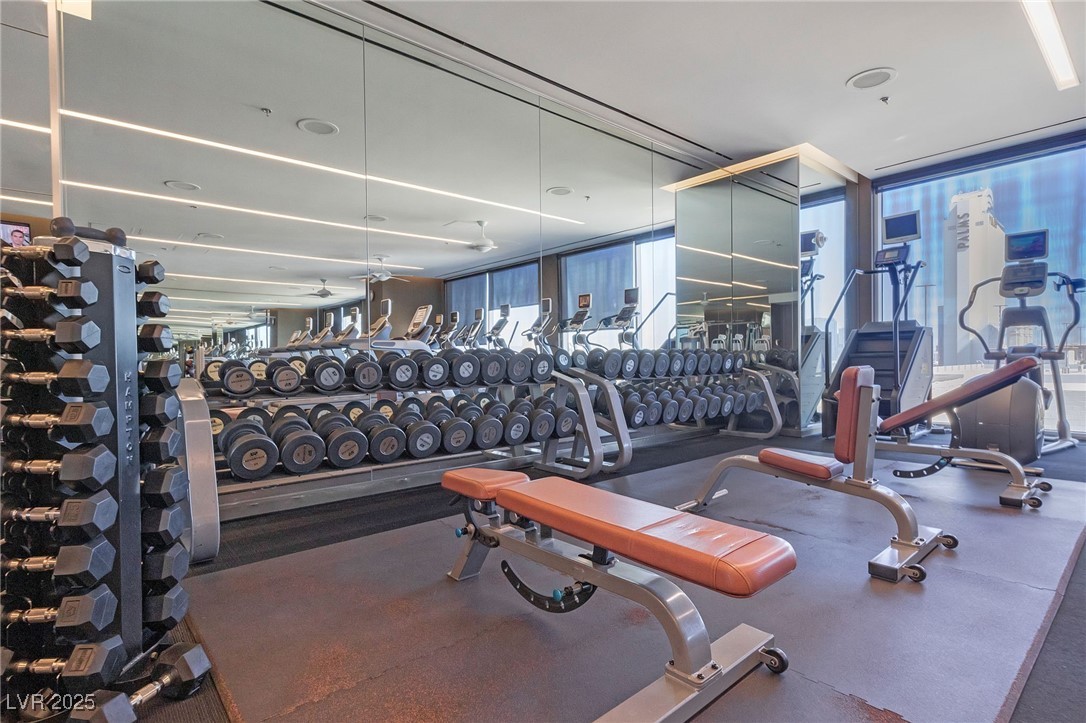4381 West Flamingo Road, Unit 58301 Las Vegas, NV 89103 - Photo 30 of 32 Gym featuring a wall of windows