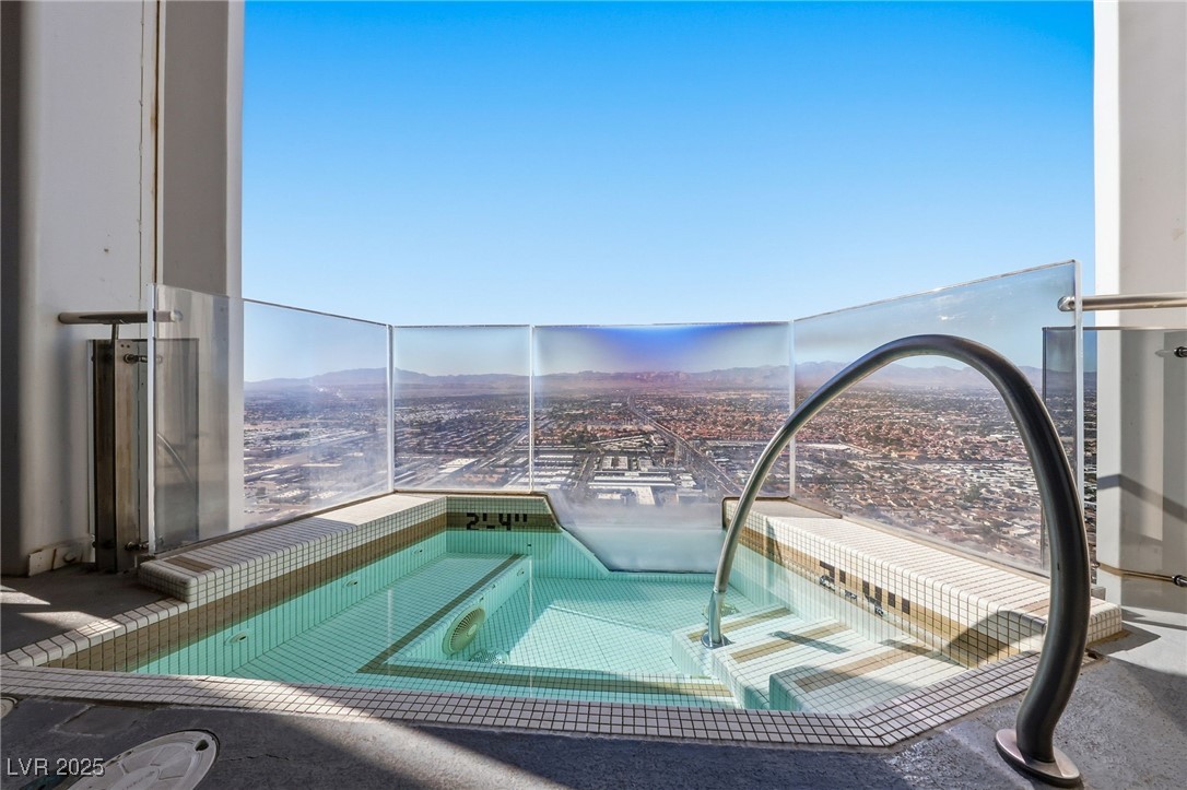 4381 West Flamingo Road, Unit 58301 Las Vegas, NV 89103 - Photo 5 of 32 View of pool with a mountain view