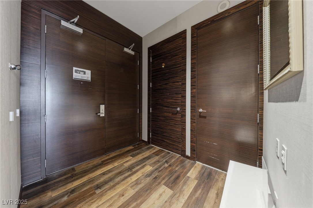 4381 West Flamingo Road, Unit 58301 Las Vegas, NV 89103 - Photo 6 of 32 Entrance foyer featuring dark wood-style floors