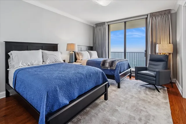 a spacious bedroom with a bed and a couch