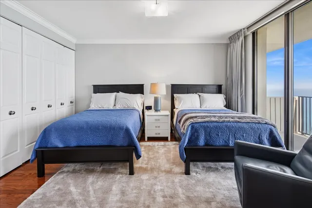 a bedroom with bed and a window