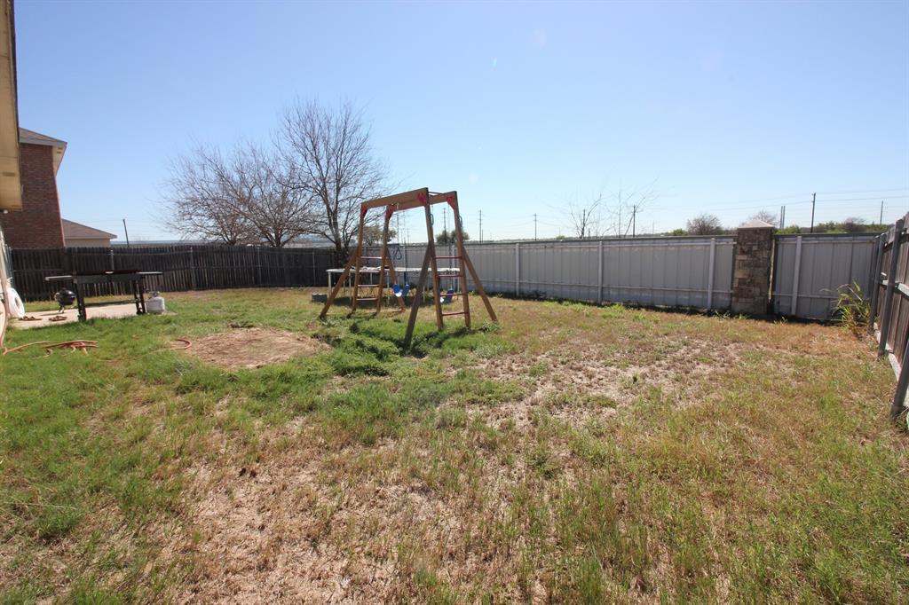 12609 Carpenter Lane Rhome, TX 76078 - Photo 28 of 29 Expansive backyard with a combination of wood and metal fencing