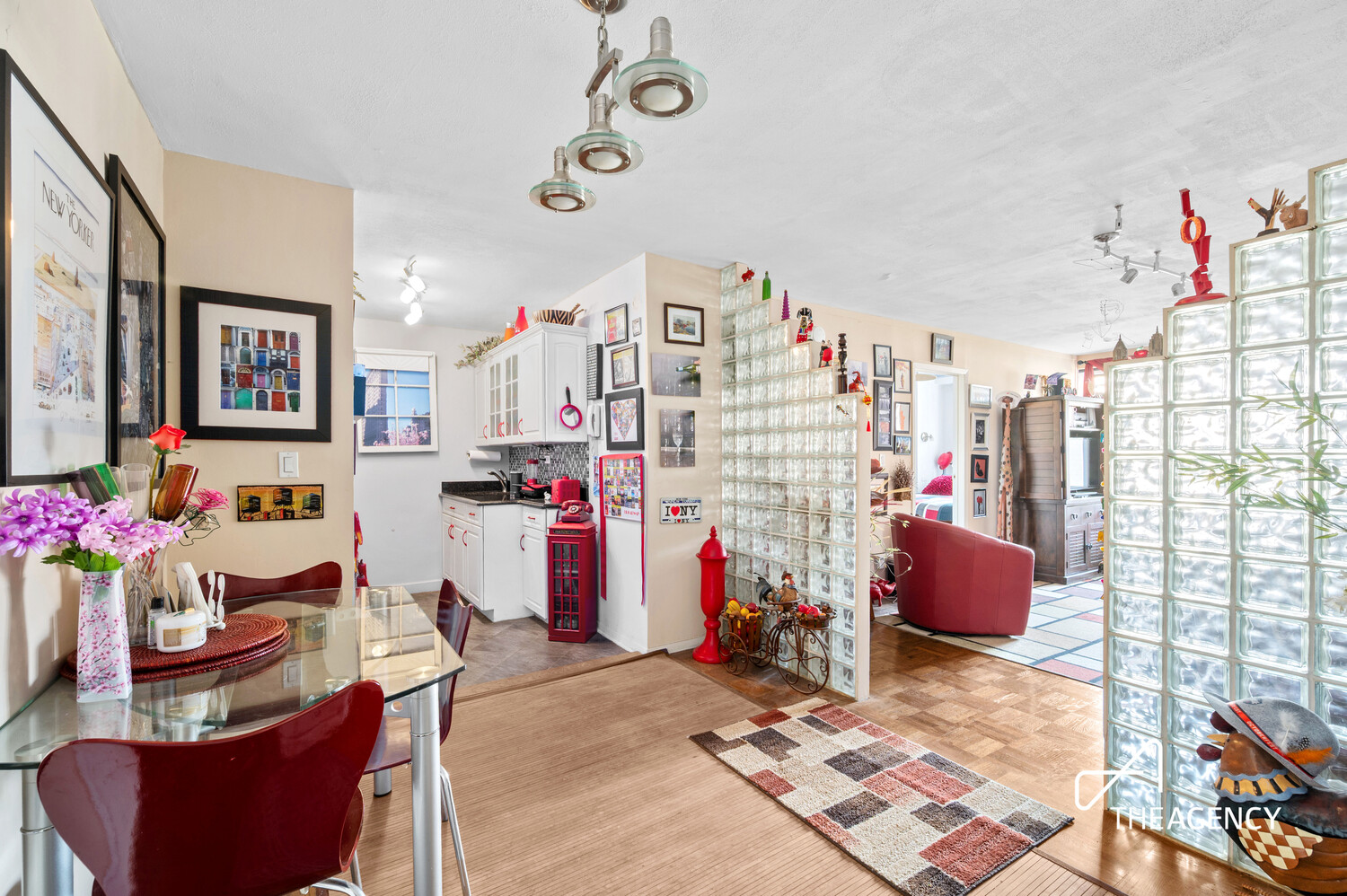 201 East 21st Street, Unit 10H Manhattan, NY 10010 - Photo 3 of 6 a living room with furniture and a chandelier
