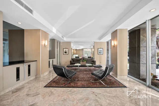 a living room with furniture and a rug
