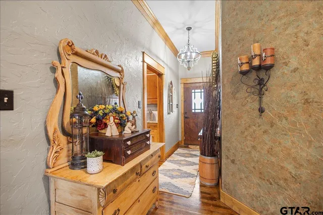 a view of living room with furniture and a mirror