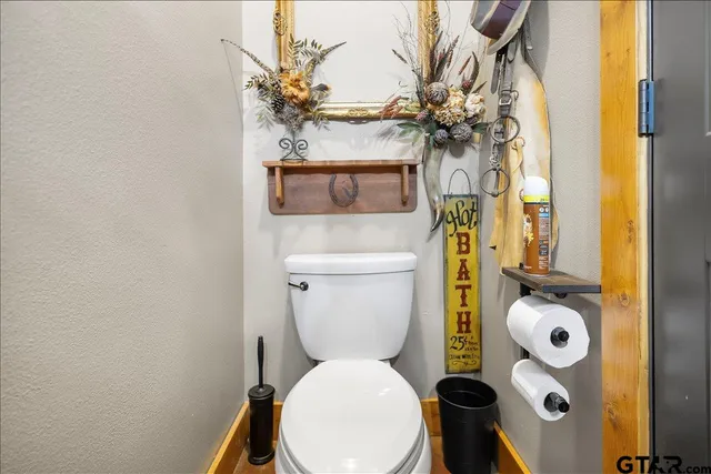 a bathroom with a toilet and a sink
