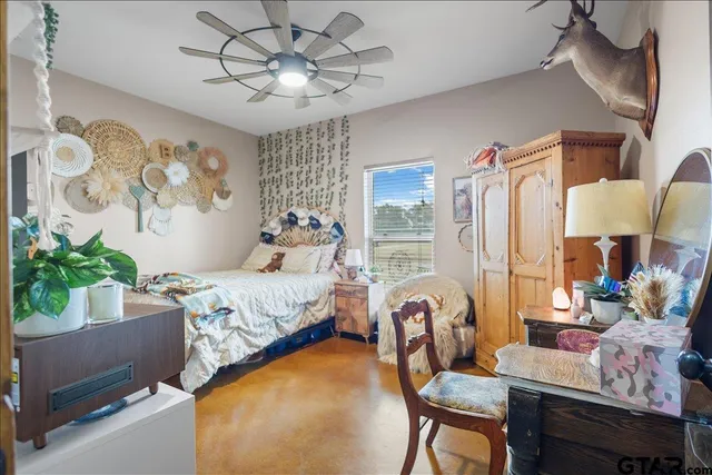 a bedroom with furniture and a bed