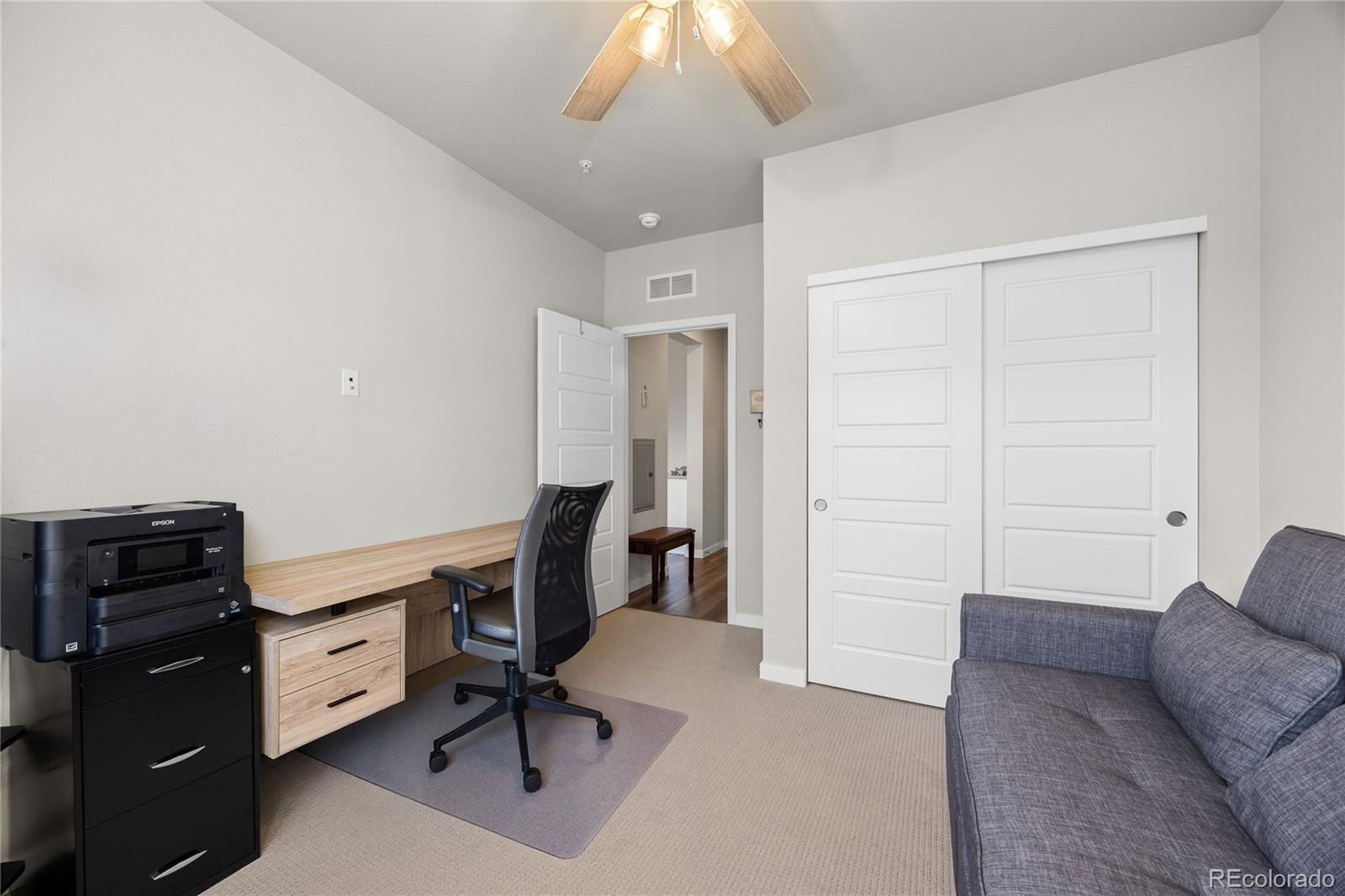 9291 Twenty Mile Road, Unit 303 Parker, CO 80134 - Photo 13 of 28 a view of workspace with furniture and natural light