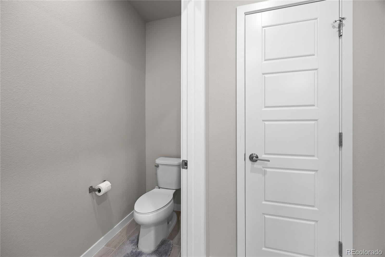 9291 Twenty Mile Road, Unit 303 Parker, CO 80134 - Photo 17 of 28 a bathroom with a toilet