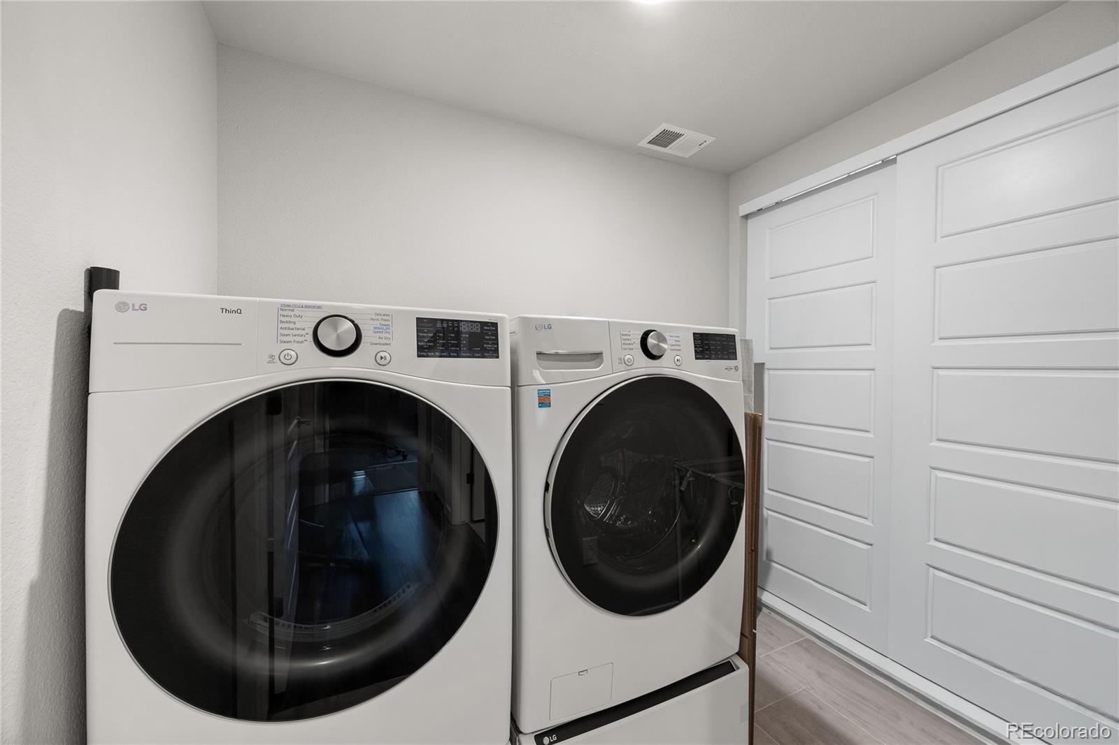 9291 Twenty Mile Road, Unit 303 Parker, CO 80134 - Photo 20 of 28 a utility room with dryer and washer