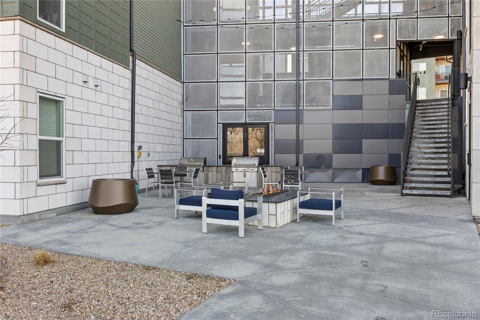 9291 Twenty Mile Road, Unit 303 Parker, CO 80134 - Photo 26 of 28 a view of a outdoor with a chairs and table in the patio