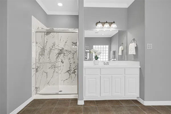 a bathroom with a sink mirror and a bathtub