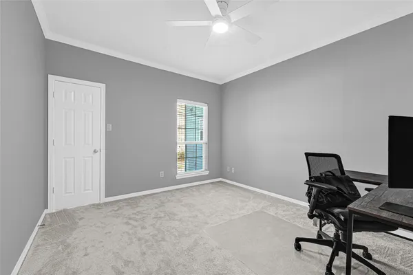 a view of a room with rack on the wall and a window