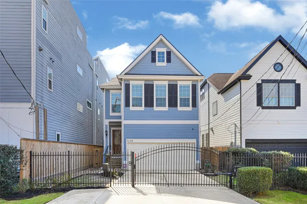 a front view of a house with garage